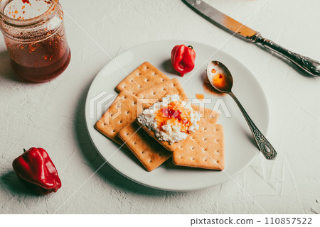 Crackers with Habanero Pepper Jam and Ricotta Cheese 110857522