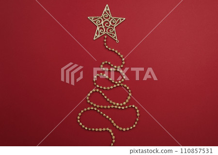 Christmas tree yellow garland on color background 110857531