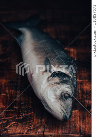 Fresh Sea Bass on Cutting Board Fresh Sea Bass on Cutting Board 110857572