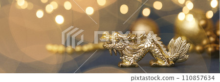 Golden dragon symbol of the year 2024 on a dark background Golden dragon symbol of the year 2024 on a dark background 110857634
