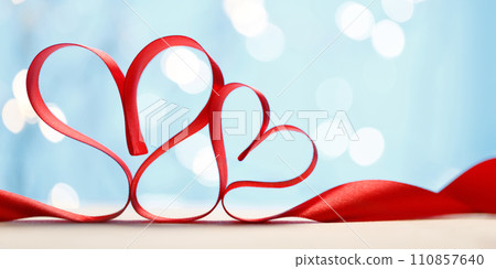 Hearts made from red ribbon. Valentine's card Hearts made from red ribbon. Valentine's card 110857640