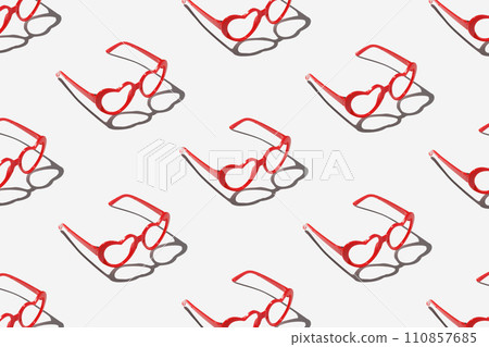 Pattern made with red heart shaped sunglasses on pastel color background Pattern made with red heart shaped sunglasses on pastel color background 110857685