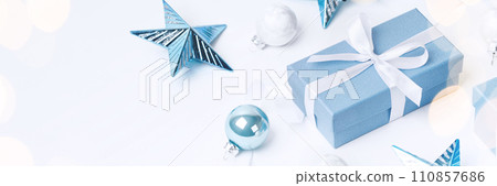 Christmas blue gifts with decorations on white background Christmas blue gifts with decorations on white background 110857686