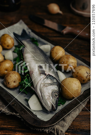 Fish Stuffed with Sorrel on Baking Sheet 110857696