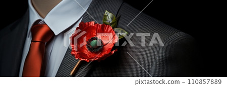 Poppy flower in the buttonhole of a man's jacket, a remembrance poppy in memory of fallen soldiers in the war, banner 110857889