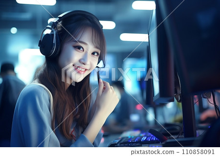 Smiling Asian girl with headphones and microphone in a call center Smiling Asian girl with headphones and microphone in a call center 110858091