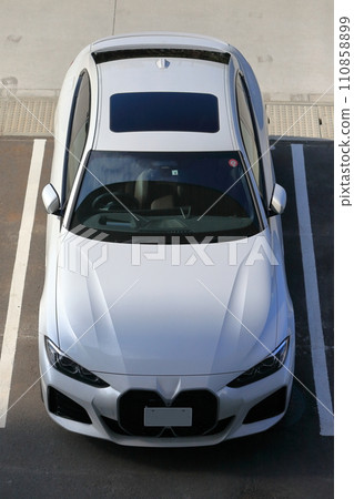 Image of a white sports car in the parking lot Image of a white sports car in the parking lot 110858899