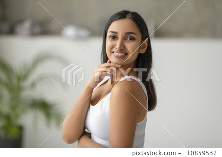 Portrait of millennial indian woman posing at bathroom 110859532