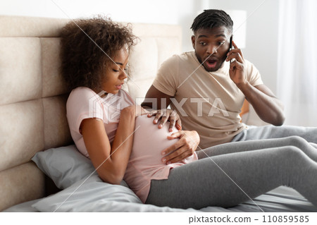 Shocked Black Husband Calling Emergency For Pregnant Wife In Bedroom Shocked Black Husband Calling Emergency For Pregnant Wife In Bedroom 110859585