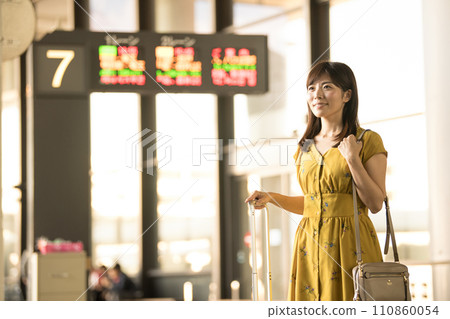 Airport arrival bus stop female Airport arrival bus stop female 110860054