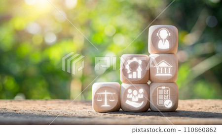 Social work concept. Wooden block on desk with social work icon on virtual screen. Society, Psychology, Social Justice, Sociology, Improvement, Economics, Community Development, Government. 110860862