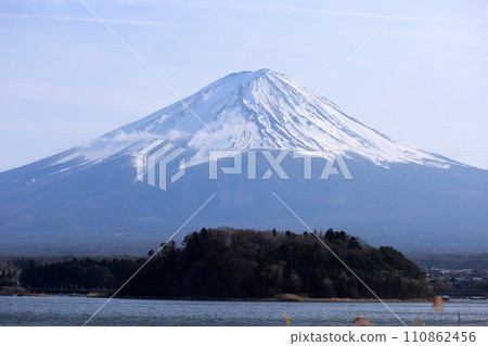Take a photo of the beautiful Mount Fuji in the distance while taking a boat trip on Lake Kawaguchi Take a photo of the beautiful Mount Fuji in the distance while taking a boat trip on Lake Kawaguchi 110862456