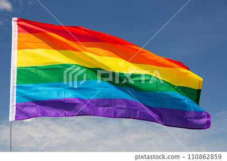 LGBT flag waving on cloudy sky during daytime 110862859