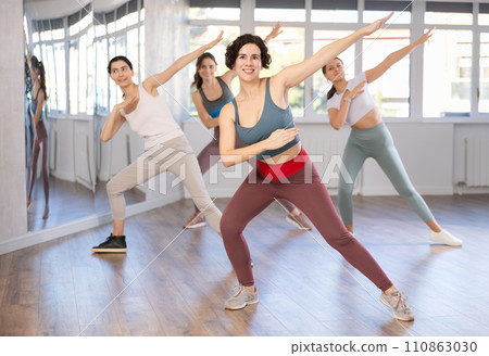 Funk jazz dancers practicing dance moves in studio 110863030