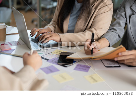 Cropped shot of a creative graphic designer team working in the office together. 110863088