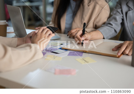 Cropped shot of a creative graphic designer team working in the office together. 110863090