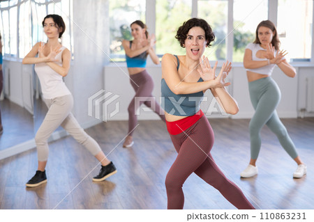 Group of women dancing modern dance in studio 110863231