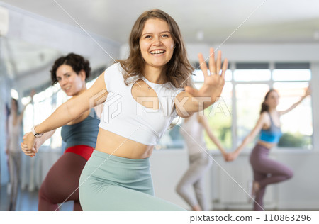 Middle-aged woman and girl are dancing vigorous pair dance in couple 110863296