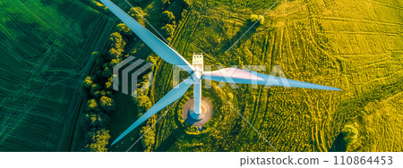 AI-generated content. Wind turbine amidst green landscape, aerial view AI-generated content. Wind turbine amidst green landscape, aerial view 110864453