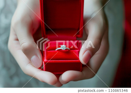 diamond ring in red box in woman hand on . ai generative 110865346