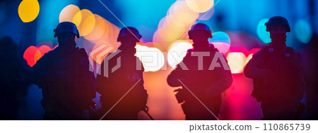 AI-generated content. silhouettes of police officers in tactical gear against a blurred background of glowing, bokeh lights in blue and red, suggesting an atmosphere of law enforcement activity at 110865739