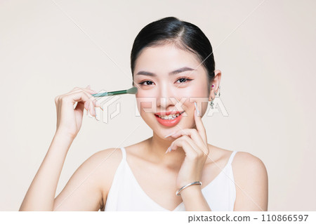 Young woman with beautiful eyeshadows on color background 110866597