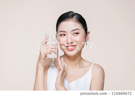 Woman with glass of fresh water in white portrait. Woman with glass of fresh water in white portrait. 110866672