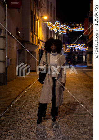 Festive Stride: A Winter Walk in the City Lights 110866758