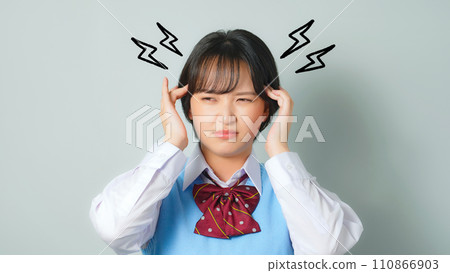 Female student wearing a headache-inducing uniform 110866903