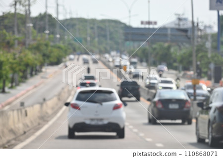 highway traffic with safety barrier on road asphalt, blurred image highway traffic with safety barrier on road asphalt, blurred image 110868071