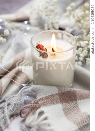 Aromatic candle on the table. 110869083