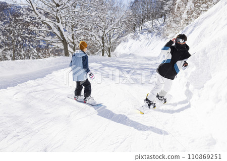 children enjoying snowboarding children enjoying snowboarding 110869251