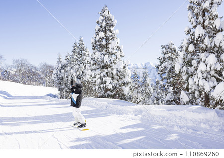 children enjoying snowboarding children enjoying snowboarding 110869260