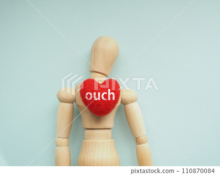 The word ouch is written on the heart of the mannequin's chest. The word ouch is written on the heart of the mannequin's chest. 110870084