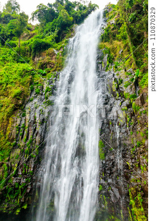 View of Materuni waterfall on the foot of the Kilimanjaro mountain in Tanzania View of Materuni waterfall on the foot of the Kilimanjaro mountain in Tanzania 110870329