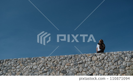 woman on the hill during the day woman on the hill during the day 110871094