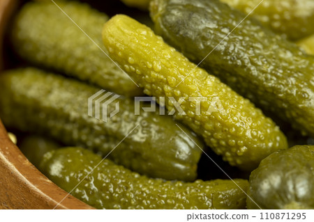 green pickled cucumbers on the table green pickled cucumbers on the table 110871295