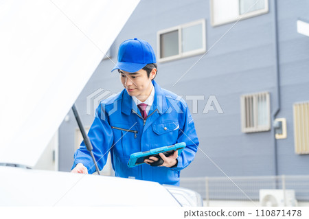 Auto mechanic inspecting the engine room Auto mechanic inspecting the engine room 110871478