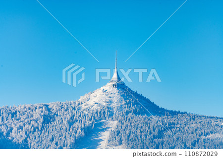 Jested Mountain with unique hotel and TV transmitter on the top on sunny winter day, Liberec, Czechia 110872029