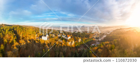 Hruba Skala chateau at cold morning sunrise time. Bohemian Paradise, Czech: Cesky raj, Czechia. Aerial view from above. 110872030