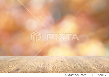 Background image of a wooden table with wood grain on a sparkling background with jade bokeh 110872067