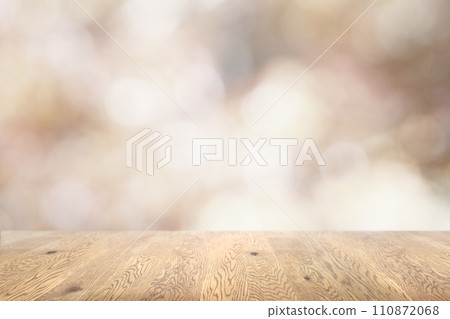Background image of a wooden table with wood grain on a sparkling background with jade bokeh 110872068