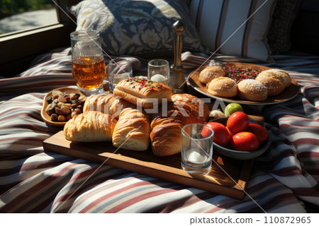 Romantic summer picnic. Snack platter on linen picnic blanket Romantic summer picnic. Snack platter on linen picnic blanket 110872965