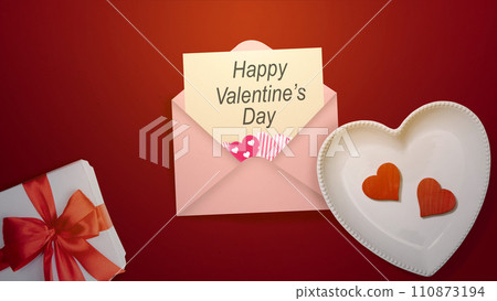Heart plate with a red heart and a Valentine's letter with a gift box Heart plate with a red heart and a Valentine's letter with a gift box 110873194