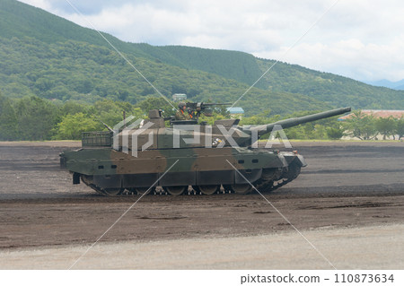 Side view of the Japan Ground Self-Defense Force Type 10 tank running Side view of the Japan Ground Self-Defense Force Type 10 tank running 110873634