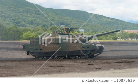 Side view of the Japan Ground Self-Defense Force Type 10 tank running 110873639