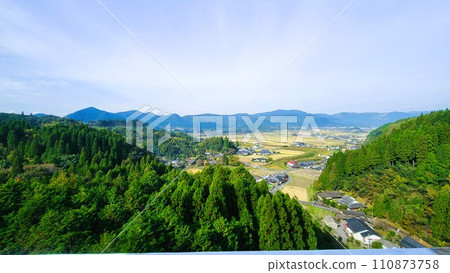 View of Ebino City from the loop bridge, with the Kirishima Mountain Range in the distance 110873758