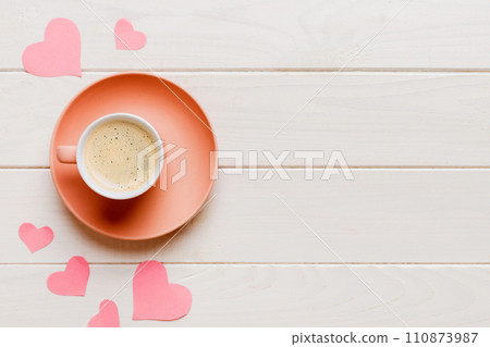 Mug coffee and gift box on colored background. Flat lay composition. Holiday concept Mug coffee and gift box on colored background. Flat lay composition. Holiday concept 110873987