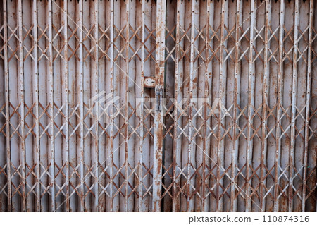 Metal and rusty closed door. Metal and rusty closed door. 110874316
