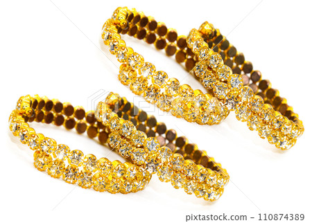 A picture of gold plated diamond bracelets with selective focus 110874389
